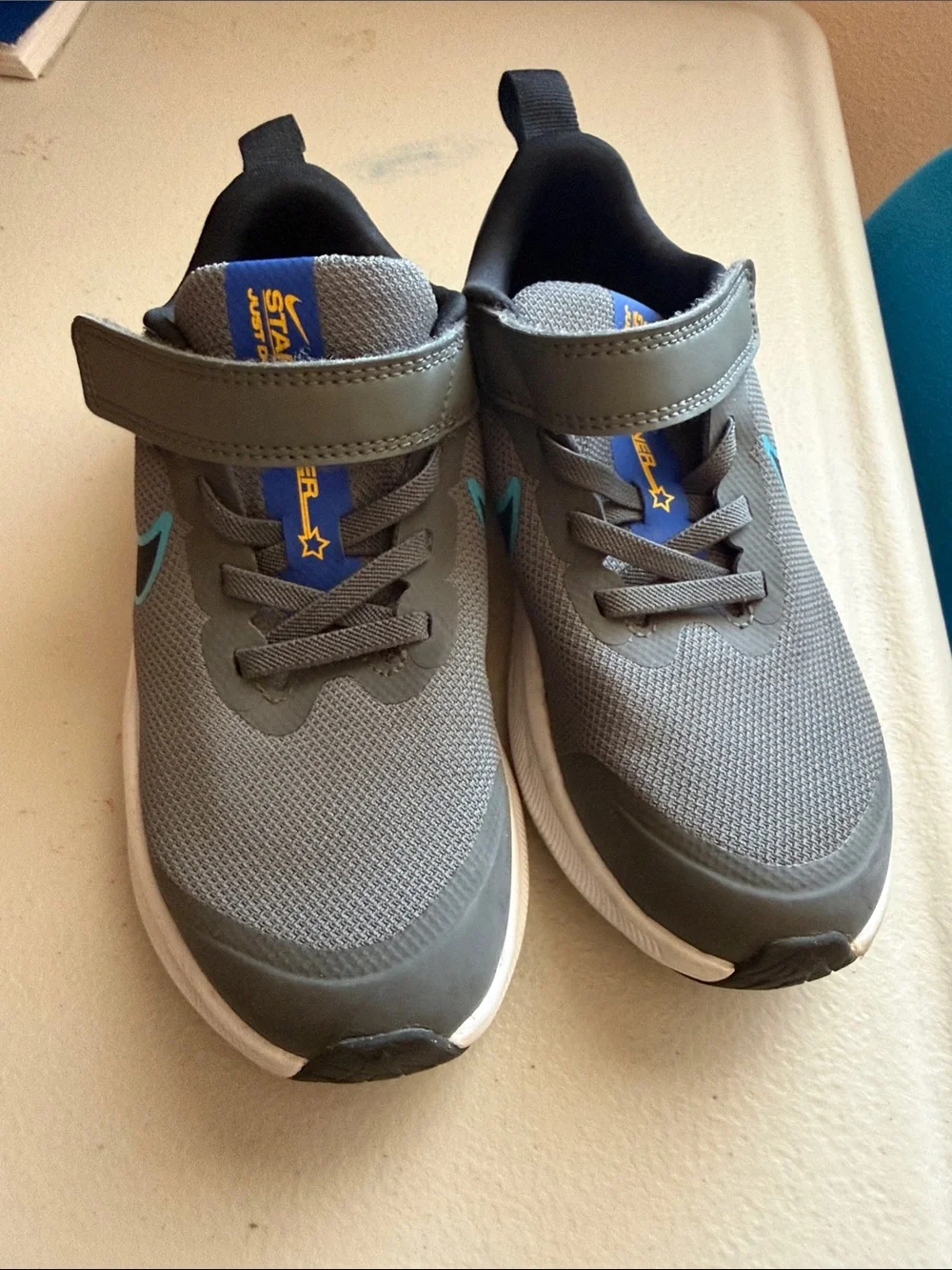 Nike Kids Gray Sneakers with Blue Accents